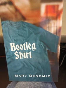 Bootleg Shirt Paperback – June 13, 2022 Mary Denomie Author - Picture 1 of 2