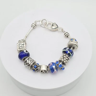 ELLEN TRACY Charm Bracelet Peace All Seeing Eye Blue Crystal Glass Silver  8" - Image 1 of 4