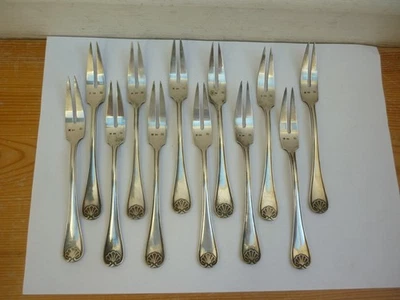 12 pics à escargot , fourchette à escargot en métal argenté modèle coquille - Photo 1/4