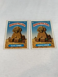 Garbage Pail Kids 1986 Serie 3 Silent Sandy #104a und Barren Aaron #104b - Bild 1 von 2