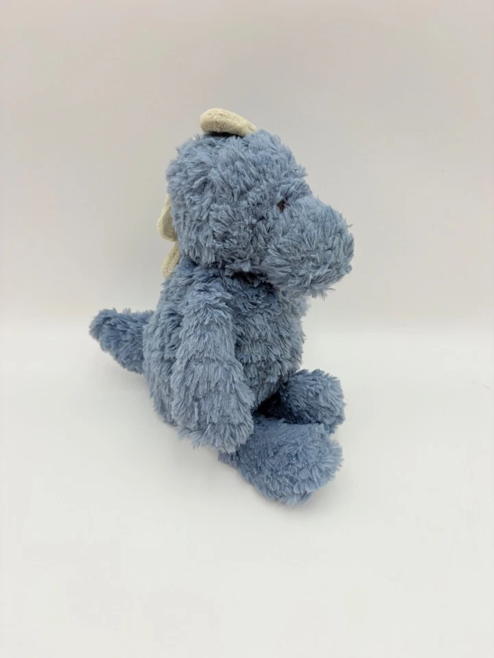 Peluche de dinosaurio azul Carters Just One You peludo difuso espigas verdes juguete para bebé Foto 1 de 4