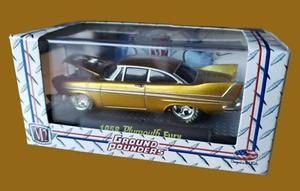 M2 Machines 1958 Plymouth Fury Ground Pounders 2009 lanzamiento 01 1:64 dorado 09-06 - Imagen 1 de 10