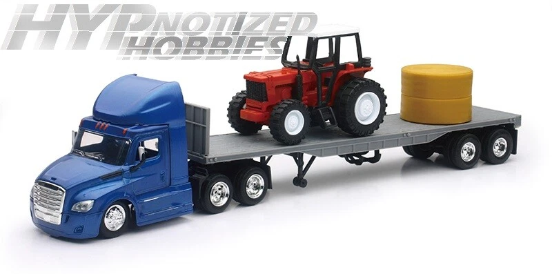 NEW RAY 1:43   FREIGHTLINER CASCADIA FLATBED W/ TRACTOR / HAY BLUE 16083 - Image 1 of 1