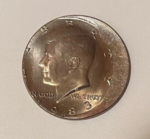 1983-P Kennedy Half Dollar 50C - Struck 15% Off Center - golden toning obv/rev - Picture 1 of 2