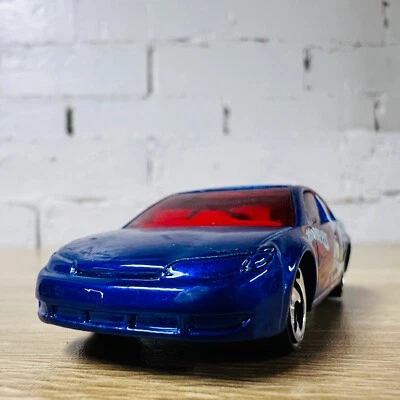 Saturn Ion Quad Coupe Blue Red 2005 Robo-Revenge 5 Pack - Image 1 of 4