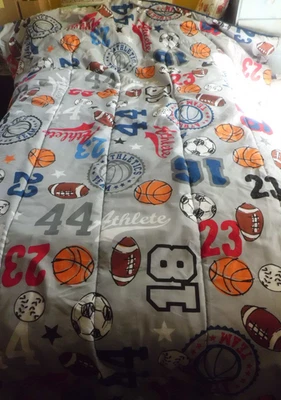 ATHLETIC TEAM SPORTS THEME TWIN SIZE COMFORTER FEATURING VARIOUS BALLS & MOTIFS - Image 1 of 4