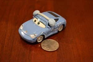 DISNEY PIXAR COCHES DÍA DE NIEVE SALLY OREJERAS MATER SALVA NAVIDAD 1:55 PORSCHE 911 - Imagen 1 de 5