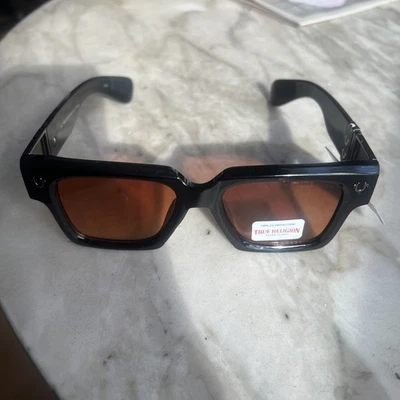 Мужские глянцевые черные пластиковые солнцезащитные очки TRUE RELIGION с оранжевыми линзами TRM1889X-9B- - Изображение 1 из 4