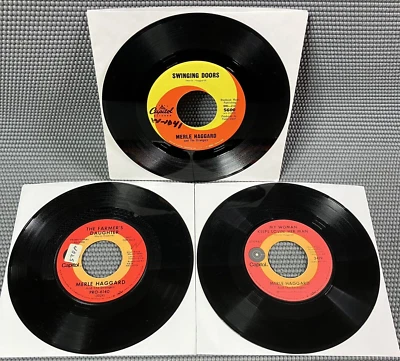 (3) Merle Haggard Vinyl 45 Swinging Doors, The Farmer's Daughter, It's Not Love - Image 1 of 4