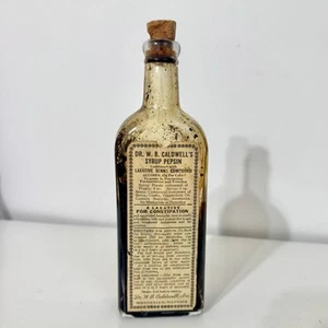 Botella en relieve de medicina boticaria Dr Caldwell jarabe pepsina corcho vintage - Imagen 1 de 7