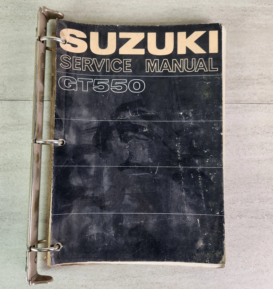 Manual de servicio Suzuki GT550 + libro de equipo eléctrico OEM 1973 anillos de carpeta Foto 1 de 4