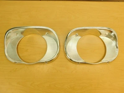 NOS BEZELS PAIR 1958 STUDEBAKER HEADLAMP DOORS SLIGHTSHELF MARKS SB-40476 - Image 1 of 4