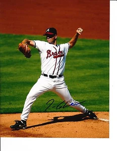 ATLANTA BRAVES TOM GLAVINE SIGNED WHITE JERSEY 8X10 - Picture 1 of 1