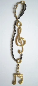 Black/Gold Metallic Music Notes 2" x 8" Iron On Applique EA-115 - Picture 1 of 2