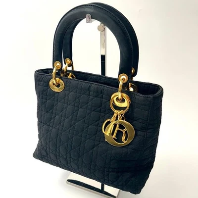 Bolso de Mano CHRISTIAN DIOR Dama Dior Cannage Bolso de Mano Nylon Negro x Herrajes Dorados Foto 1 de 4