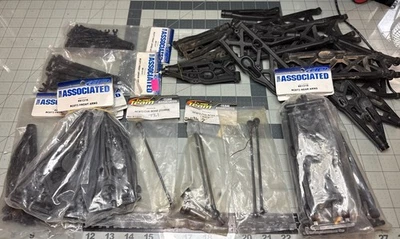 TEAM ASSOCIATED RC8T3 Arms Axles Lot - Image 1 of 4