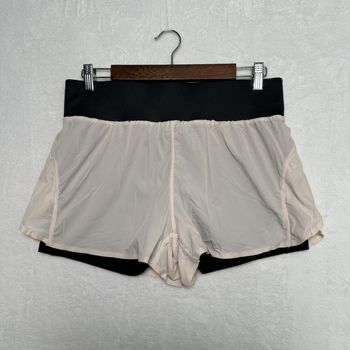 Pantaloncini Fabletics Celine Run taglia M rosa chiaro blush doppio strato tasca telefono