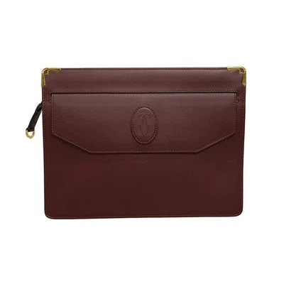 Auténtico bolso clutch Cartier Must Line de cuero burdeos para hombre Foto 1 de 4