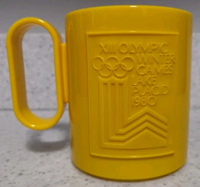 Vintage 1980's Winter Olympics Lake Placid Commemorative Plastic Mug Cup Yellow - Image 1 of 4