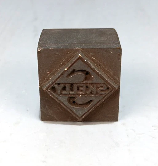 Vintage Advertising Brass Printing Block SKELLY 1.10" x 1.10" - Image 1 of 1