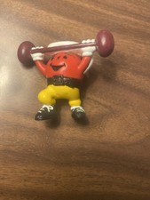 KOOL-AID MAN lifting weights stamped KRAFT/GENERAL FOODS about 2.25 inches tall
