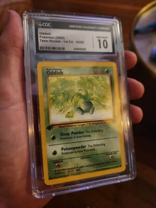 Tarjeta Pokémon Team Rocket CGC 10 GEMAS COMO NUEVA Extraña 1ª Edición 63/82 - Imagen 1 de 8