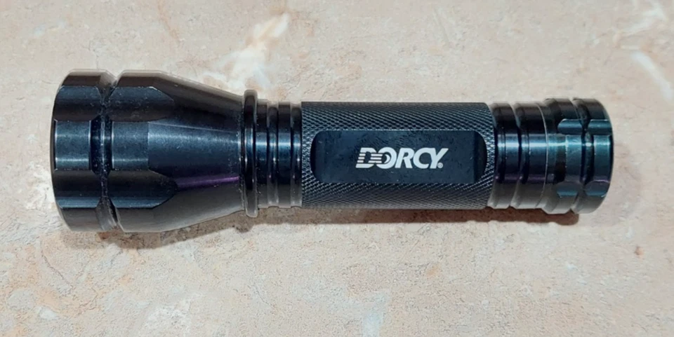 Dorcy LED Aluminum Black Flashlight 5" W/ Panasonic AAA Rechargeable Batteries - Image 1 of 4