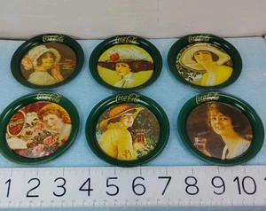 Conjunto de 6 posavasos redondos de metal vintage victorianos de Coca-Cola para damas hechos en los años 80 - Imagen 1 de 10