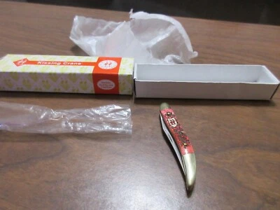 Cuchillo de hueso rojo con palillo de dientes grúa besadora nuevo en caja Foto 1 de 4