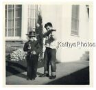 FOUND B&W PHOTO G_3052 TWO BOYS ONE IN COWBOY COSTUME BOTH HOLDING TOY GUNS