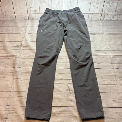 Pantalones deportivos Under Armour ajustados grises tobillos ajustables para hombre talla mediana Foto 1 de 4