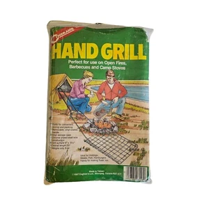 Parrilla de mano Coghlan’s 8558 de colección al aire libre caza camping pesca preparador 1987 nuevo de stock - Imagen 1 de 2