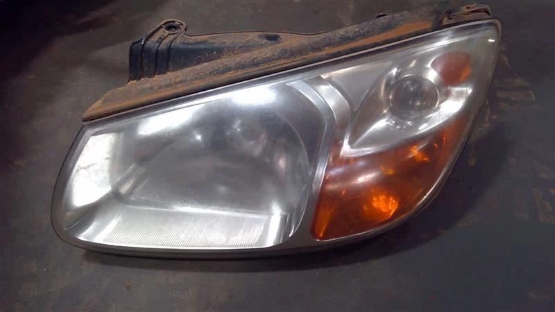 Левая фара для седана 4 двери EX подходит для KIA Spectra 2007-2008 годов выпуска от оригинального производителя - Изображение 1 из 4