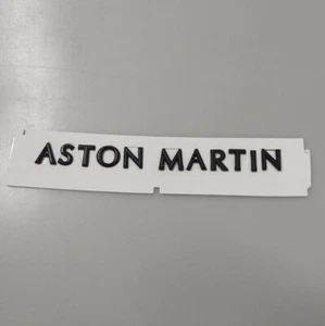 🆓🚚 Aston Martin Script Badge Rear Emblem Glossy Black JY53-001B40-AA - Bild 1 von 4