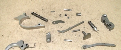 WALTHER PPK .380 ACP TRIGGER, TRIGGER GUARD, BAR, MAGAZINE CATCH, STRUT, PARTS. - Image 1 of 4