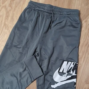 NUEVO Pantalones deportivos Nike Jordan Jumpman clásicos con logotipo gris humo para niños talla M 24X25" - Imagen 1 de 7