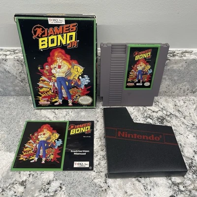 James Bond Jr. Nintendo NES (1991) with Box Manual Sleeve & Box Protector Tested - Image 1 of 4