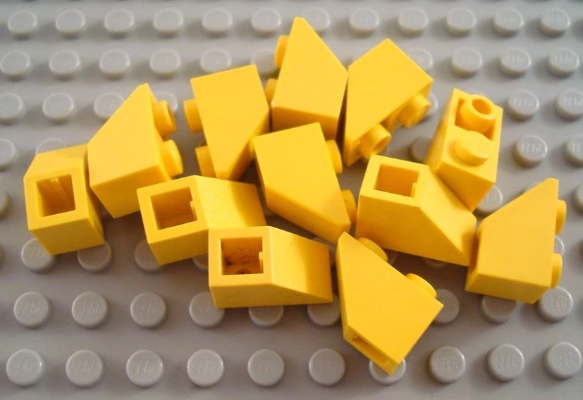 LEGO Lot of 12 Yellow 2x1 Inverted Slopes Parts and Pieces - Image 1 of 1