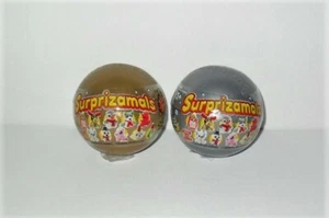 SURPRIZAMALS HOLIDAY SERIES 2 LOT OF (2) SILVER AND GOLD RANDOM BLIND CAPSULES - Picture 1 of 1