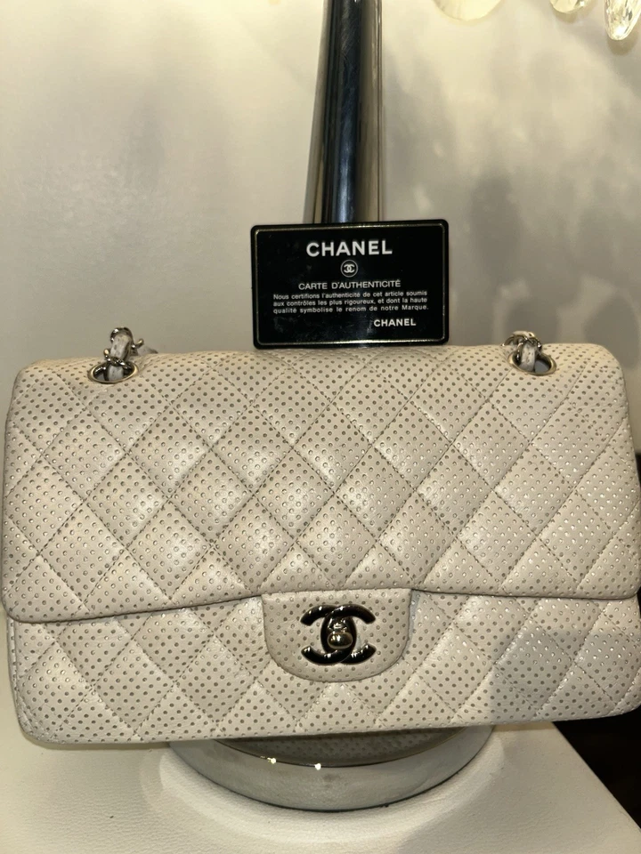 Authentic Chanel Perforated Quilted Flap Bag White Caviar Leather Silver Chain - Image 1 of 4