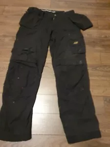 PANTALÓN SNICKERS ROPA DE TRABAJO 3211 NEGRO TALLA 148 PARA HOMBRE USADO RASGADO W33 L35 - Imagen 1 de 7