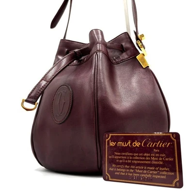 Bolso de hombro CARTIER Must Line de cuero con cordón logotipo dorado burdeos de Japón Foto 1 de 4