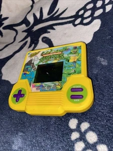 Tiger Teenage Mutant Ninja Turtles Dimension X Assault Juego Electrónico Portátil - Imagen 1 de 11