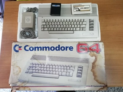 Commodore 64 II (C64C) box + alimentatore + cartucce giochi - Immagine 1 di 4