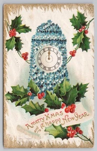 A Merry Xmas and Happy New Year Clock of Blue Flowers c1910 Postcard - Picture 1 of 2