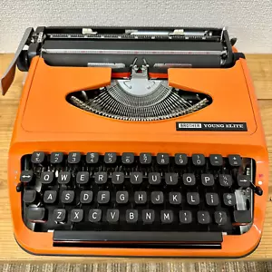 Máquina de escribir Brother Young Elite Retolo vintage antigua naranja/negra usada como estáJP - Imagen 1 de 6