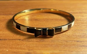 Kate Spade Take A Bow Bangle Bracelet Cuff Black And White Gold Tone, 7 1/2” - Picture 1 of 4
