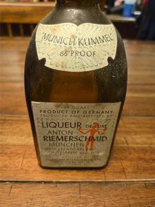 Botella de colección alemana Anton Riemerschmid esmaltada en relieve vacía Munich Kummel - Imagen 1 de 7