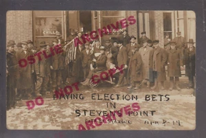 Stevens Point WISCONSIN RPPC 1914 ELECTION BET Flag PUSHING MAN WHEELBARROW Bar - Picture 1 of 3