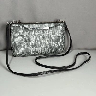 TUMI Crossbody Travel Wallet Herringbone Black White Double Zip Leather Trim - Image 1 of 4